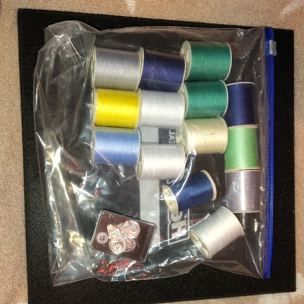 Assorted Sewing Thread Spools and Buttons